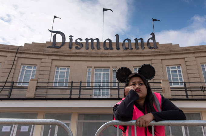 WESTON-SUPER-MARE, ENGLAND - AUGUST 20: A steward is seen outside Bansky's 'Dismaland' exhibition, which opens tomorrow, at a derelict seafront lido on August 20, 2015 in Weston-Super-Mare, England. The show is Banskys first in the UK since the Banksy v Bristol Museum show in 2009 and will be open for 6 weeks at the Topicana site. (Photo by Matthew Horwood/Getty Images)